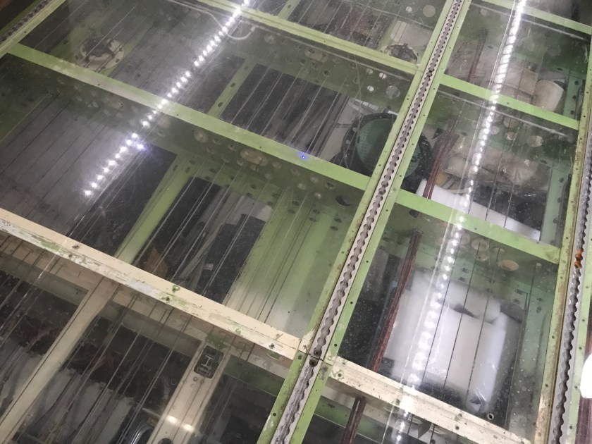 Stainless steel controlling cables can be seen through the floor