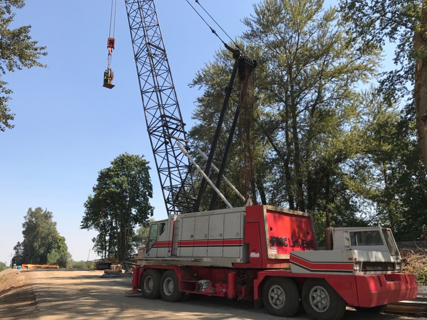 Massive crane past bridge