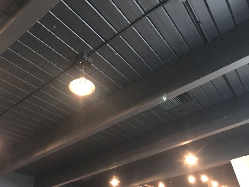 The black ceiling and Edison bulbs work very well together