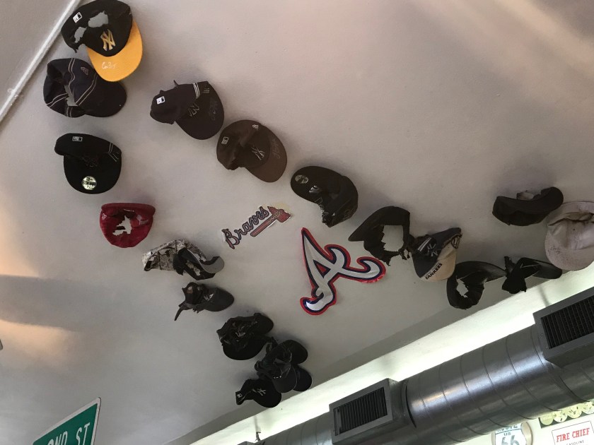 Addi burns any New York Yankee hats she sees diners wearing