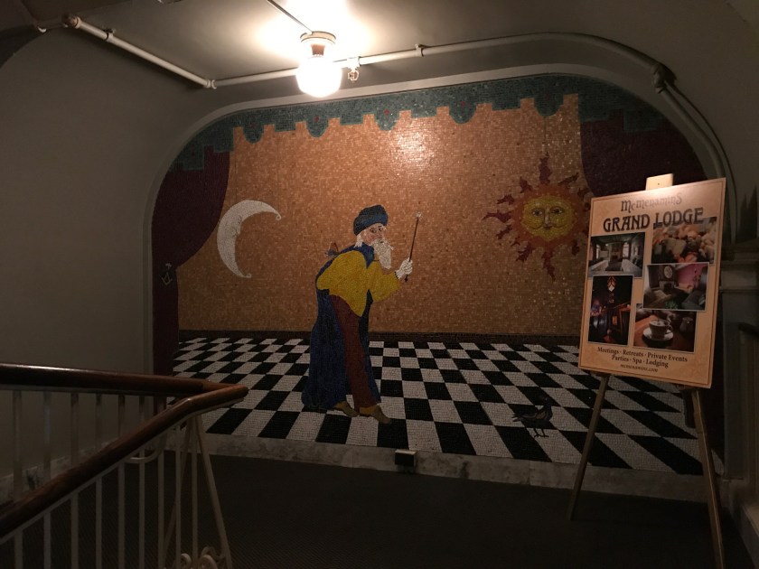 Tile wall mural between first and second floor on the way to the theatre