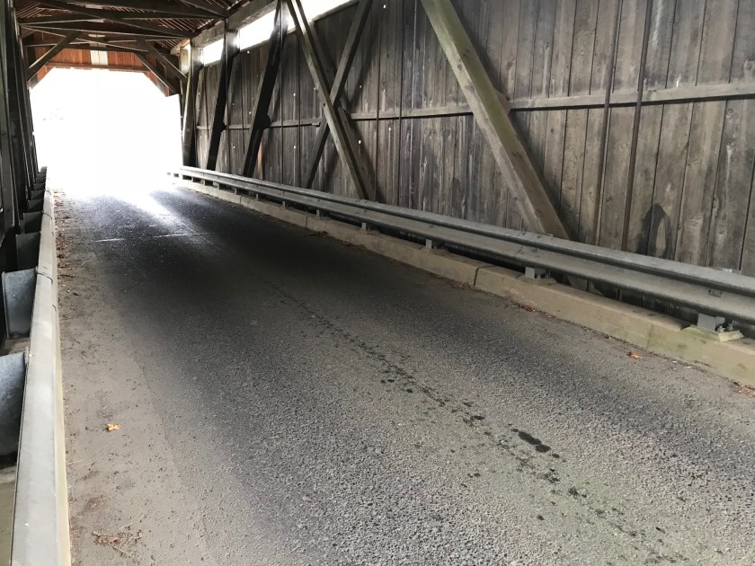 The concrete roadway is a very unusual feature I’ve never seen in a wooden cover red bridge before