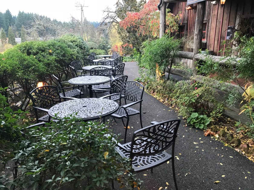 Tables in front of the main entrance all wrought iron and comfortable looking