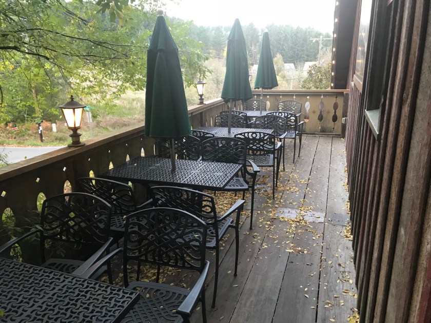 Tables on the second floor front porch