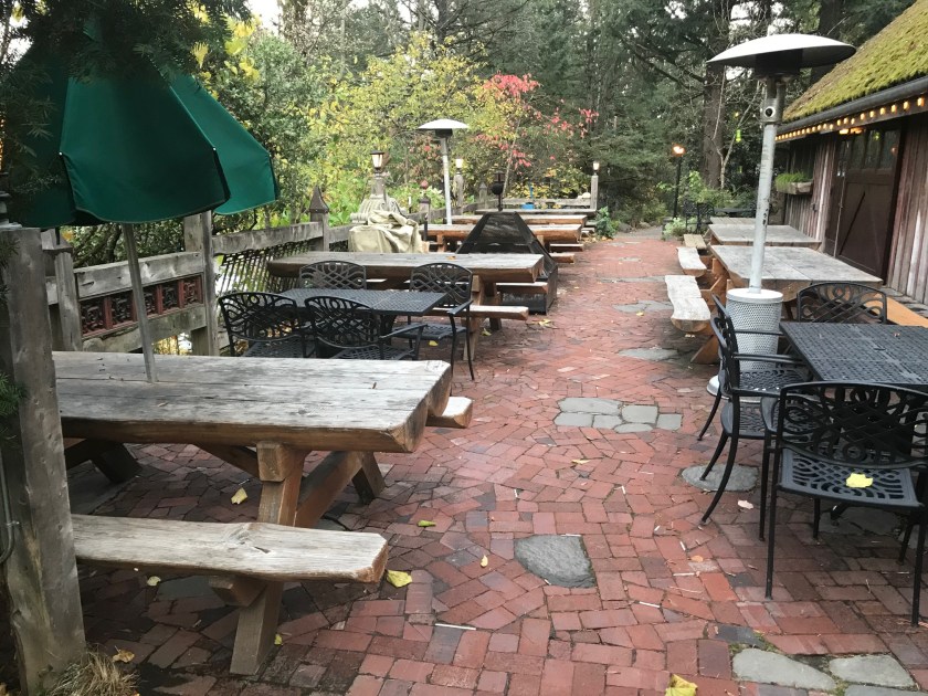 The tables on the side of the Rock Creek Tavern - made from split logs