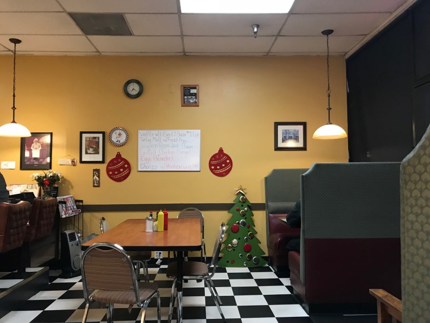 The table near the front door that can fit a couple extra folks more than some of the other spots - and the specials are just nearby