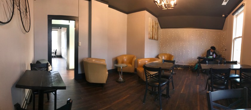 The room across the way from the classroom has many comfortable chairs and several tables suitable for laptop use