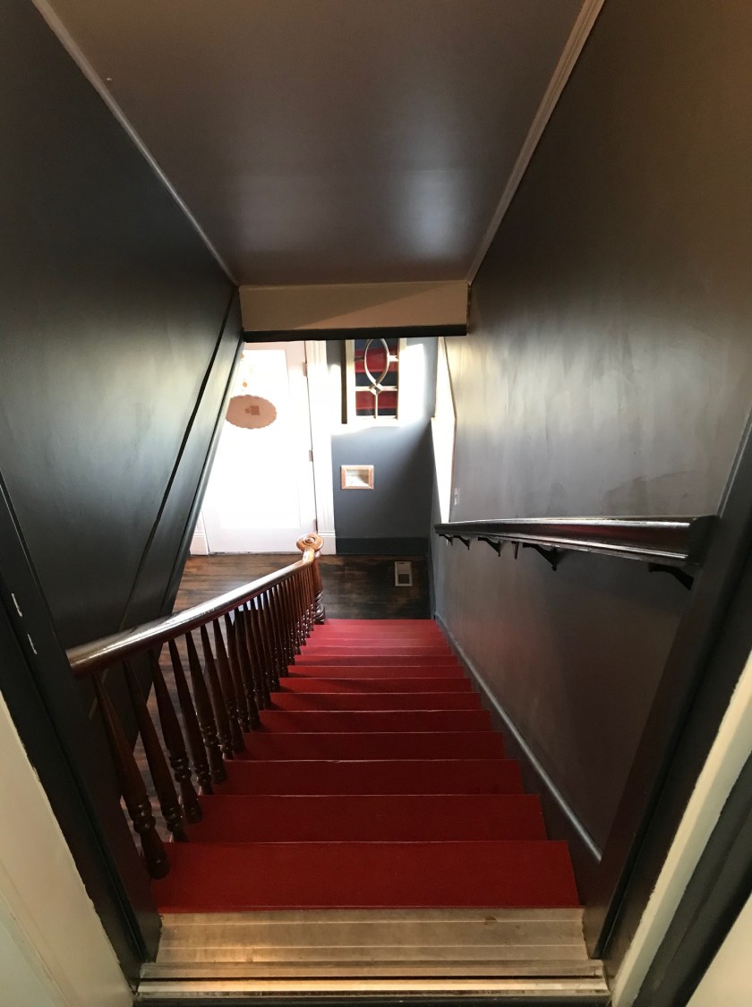 Looking down the stairs from the second-story the color scheme at Telvet is much appreciated