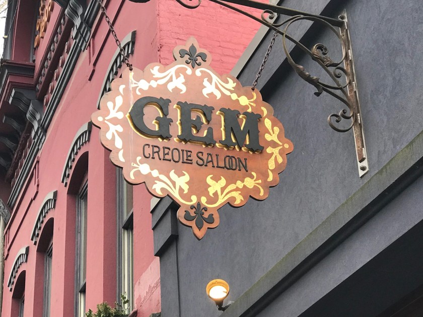 Gem’s sign matches the rest of the exterior - with gold highlights and fleur-de-lis sigils