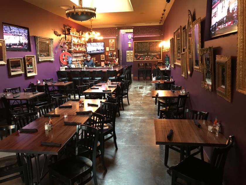 The dark purple colors and gold colored frames work together to create a wonderful mosaic